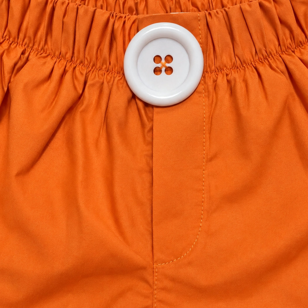 Boxerino in arancione "Bottoncione bianco”